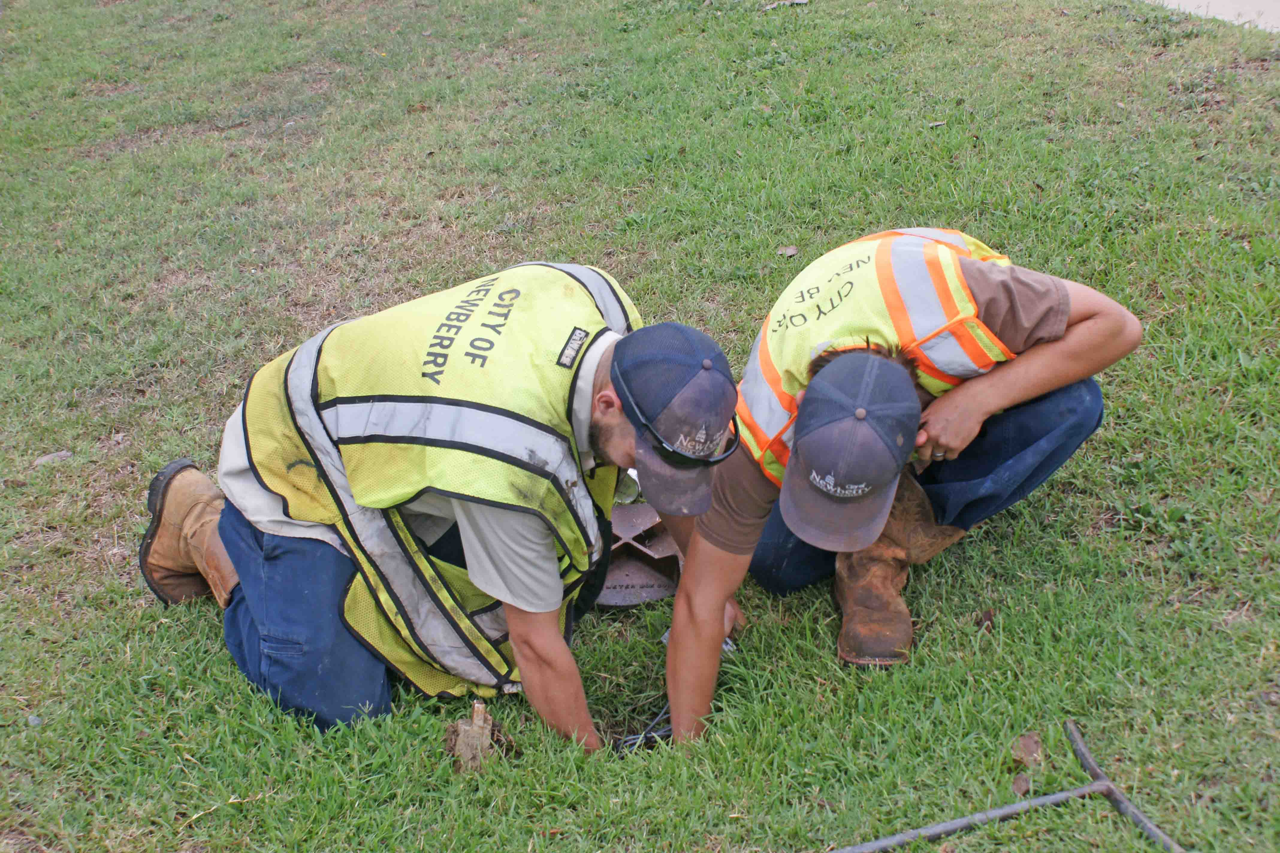 City of Newberry sewer employees changing out a water meter