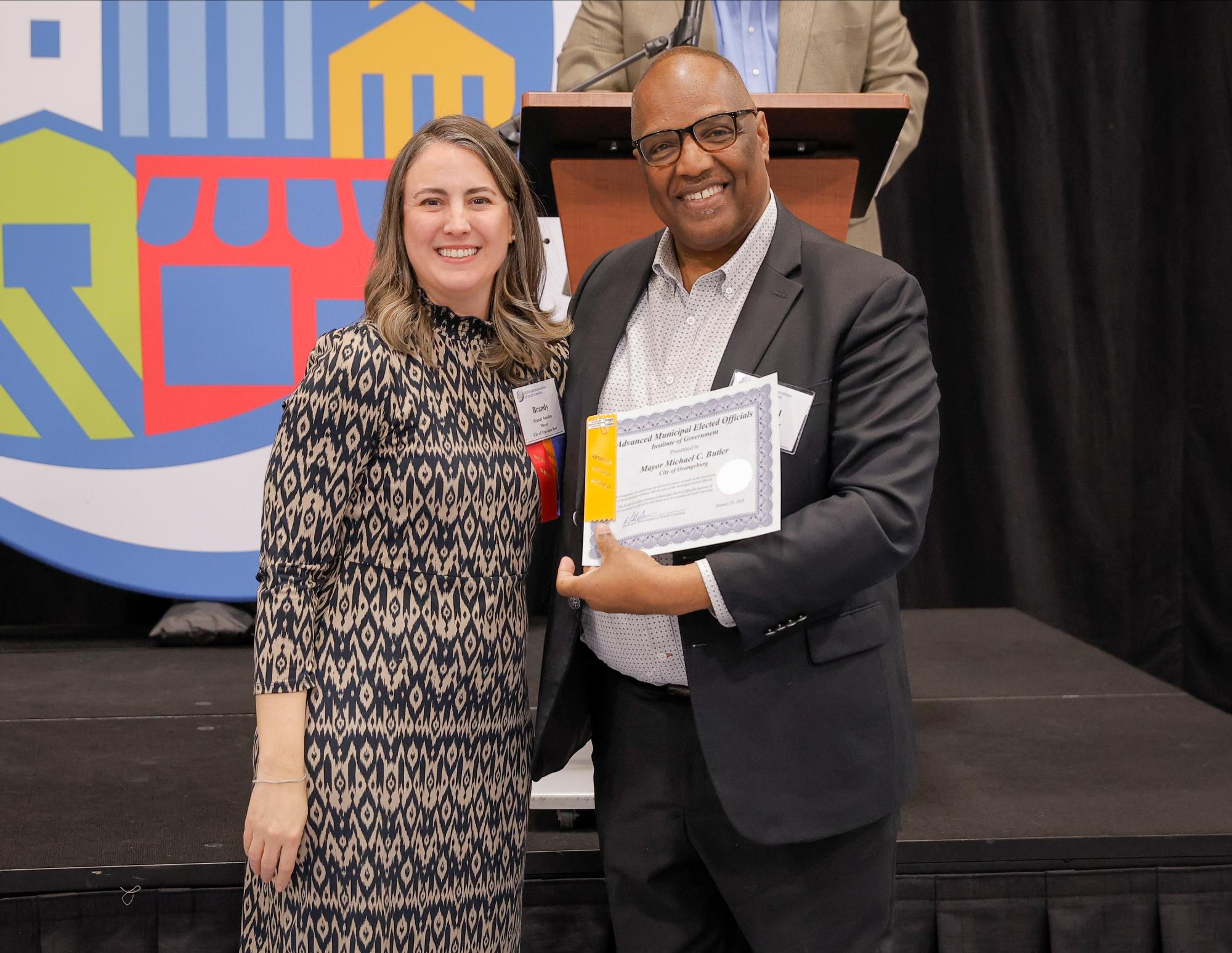 Mayor Michael C. Butler and Mayor Brandy Amidon, Municipal Association President.