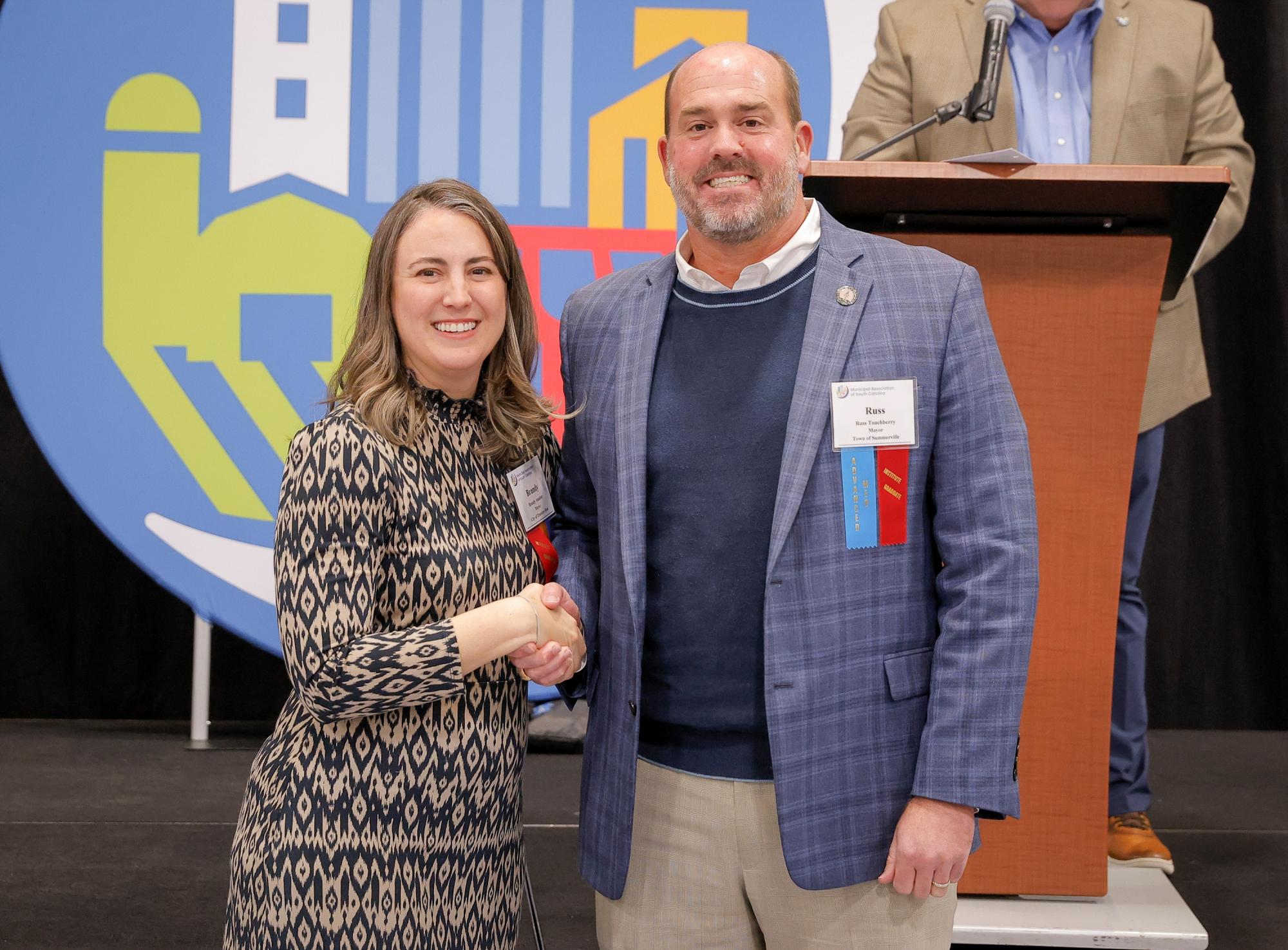 Mayor Russ Touchberry and Mayor Brandy Amidon, Municipal Association President.