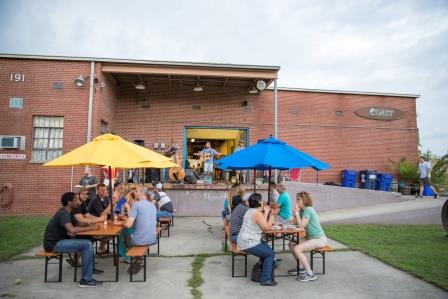 Craft beer lovers gather behind COAST Brewing Co.