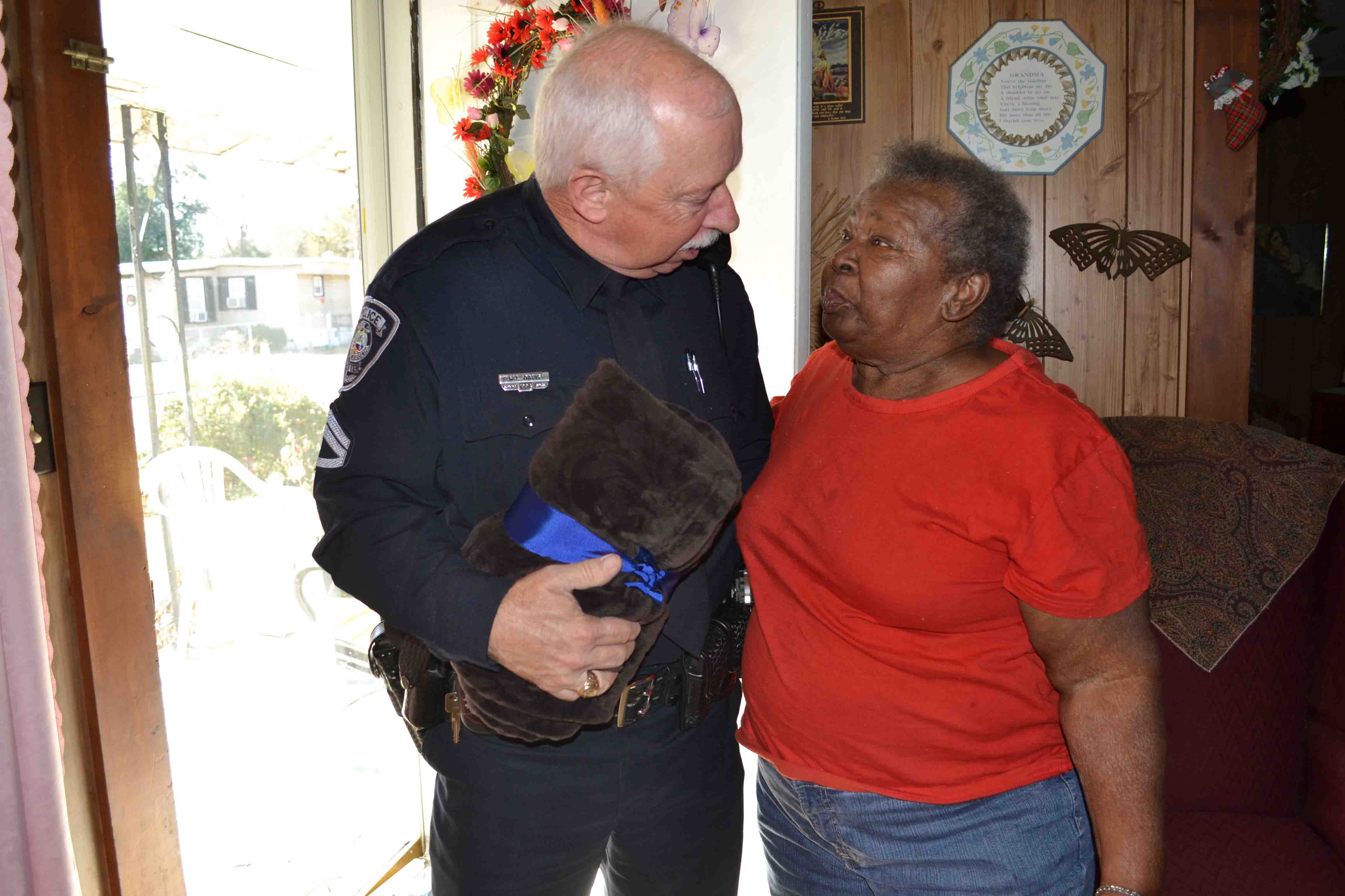 Papa G of Sumter Police Department assisting resident through the department's CheckMate program