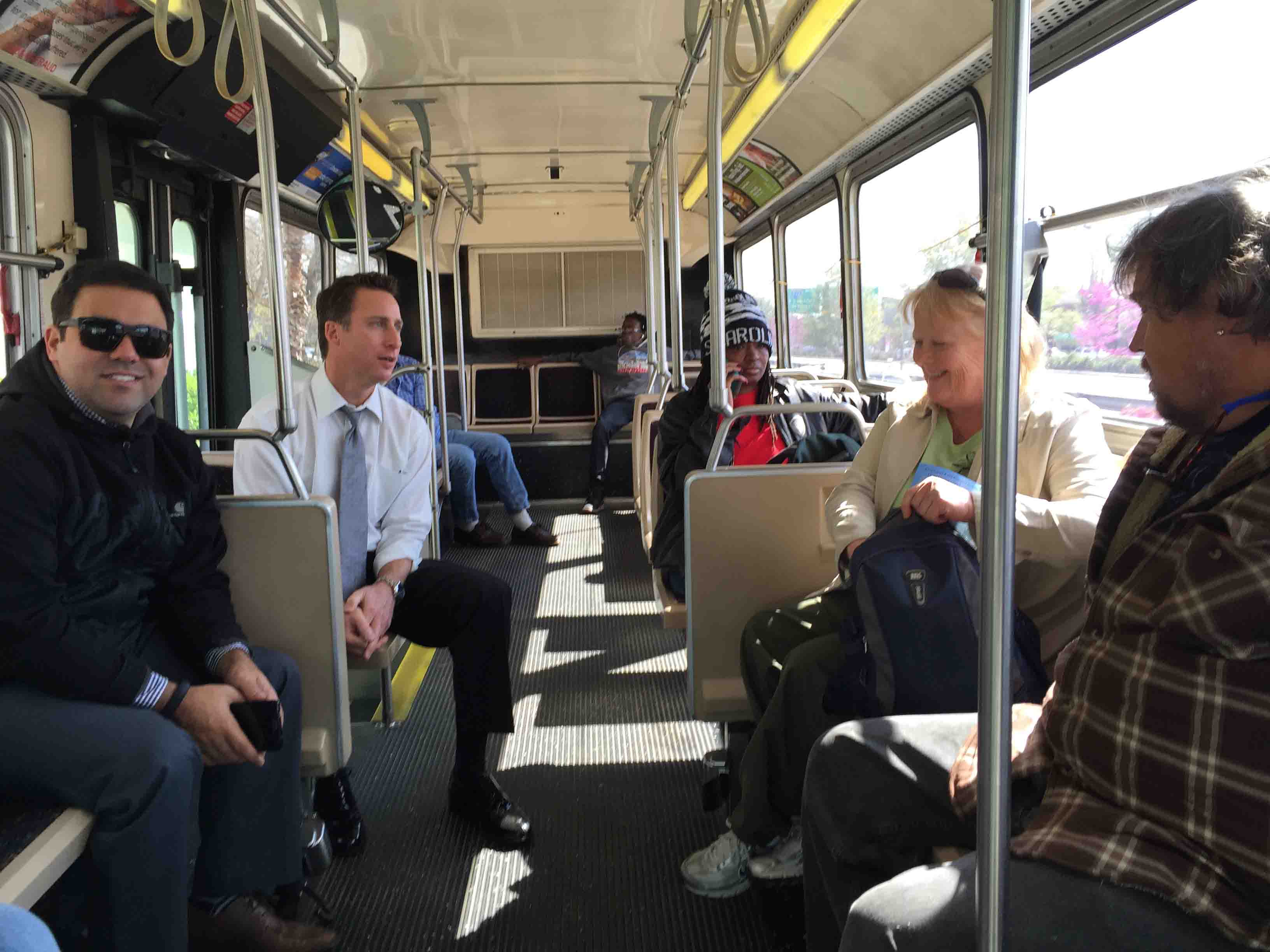 Town of Mount Pleasant administrator riding bus with residents