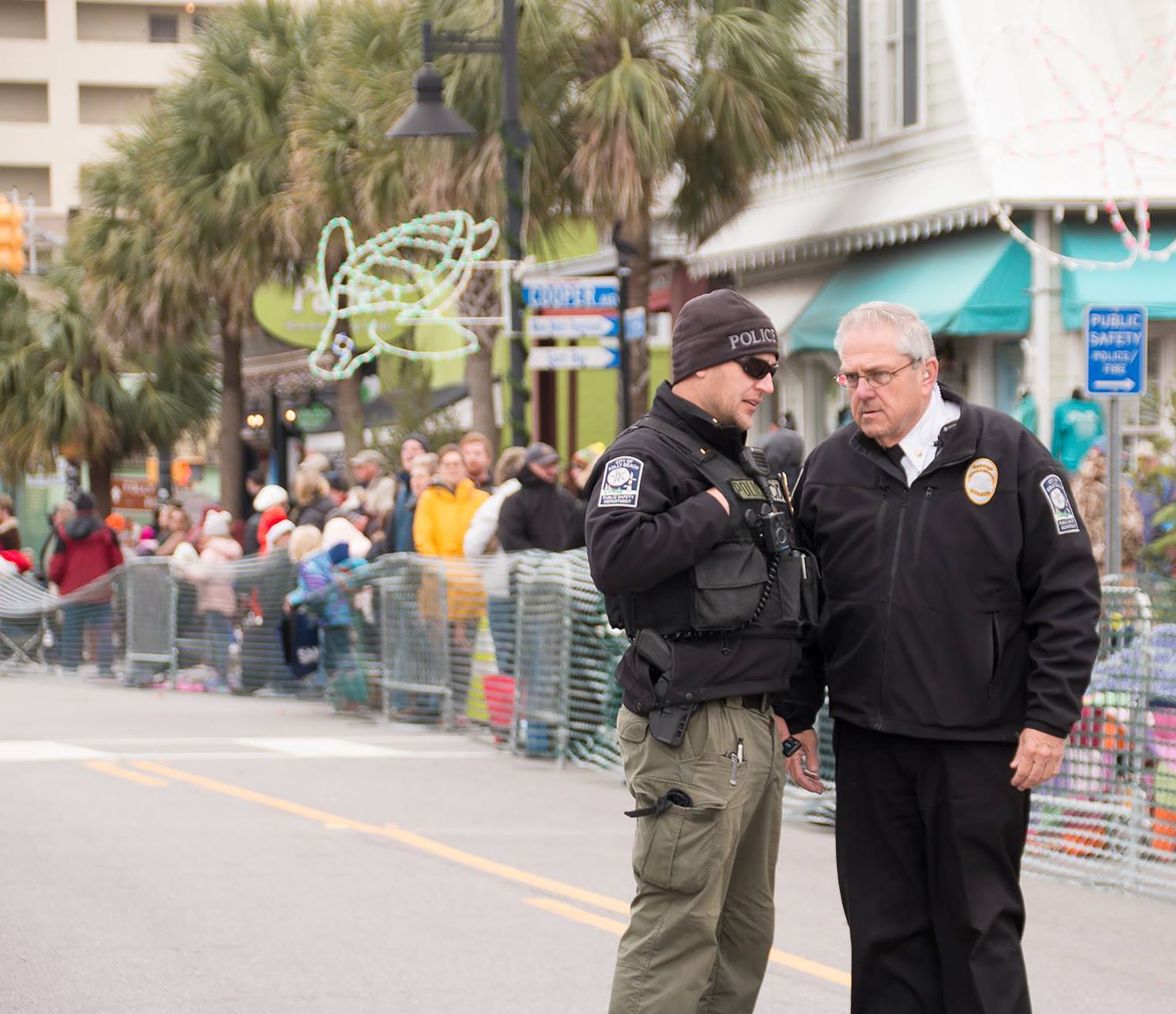 Lt. Matthew Hlavac, left, and Dept. Chief Rocky Burke provide support for the Folly Beach Christmas Parade.