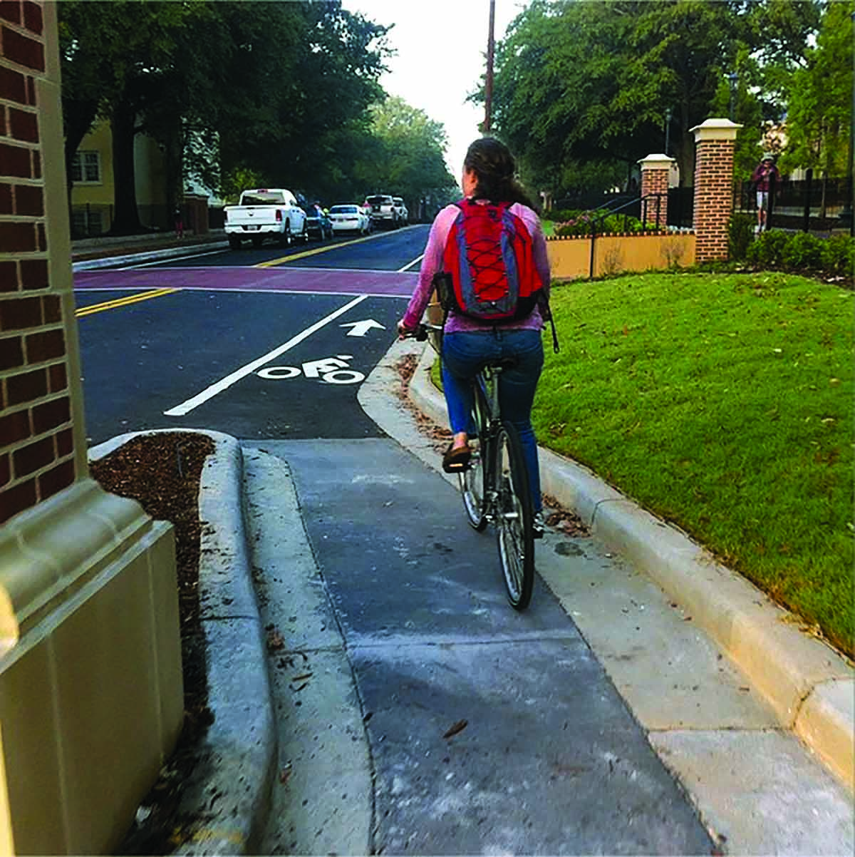 A Greene Street bicycle lane travels around the outside of a gate post on the University of South Carolina’s campus in Columbia
