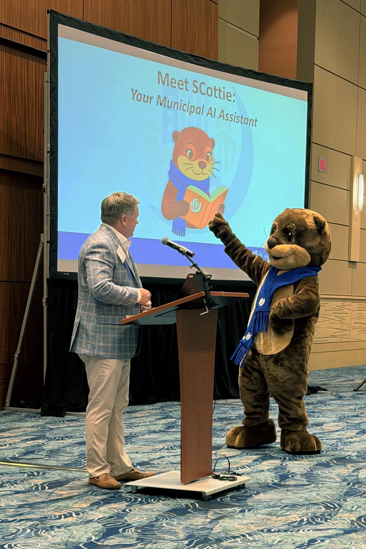 Municipal Association of SC Deputy Executive Director Jake Broom introduces SCottie during the Small Cities Summit.